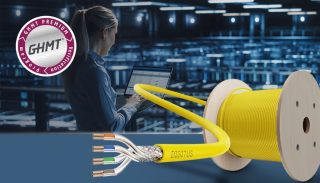 Gelbes Kalbel auf Kabeltrommel und GHMT-Siegel