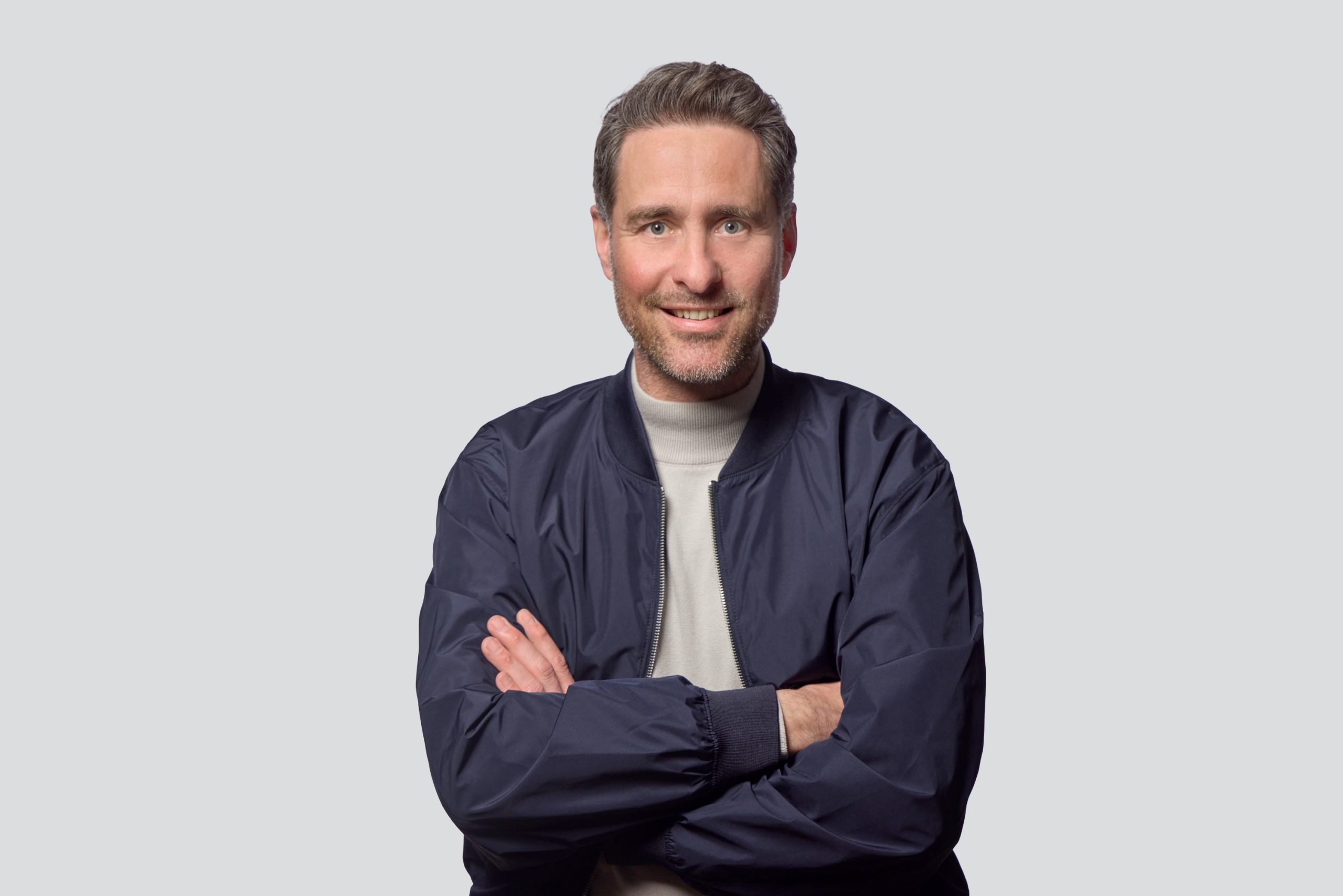 André_Furtkamp grinst in die Kamera